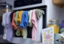 Celebrating Firsts: Documenting Your Baby’s Milestone Moments Baby chaos: book, sock, milestone card.