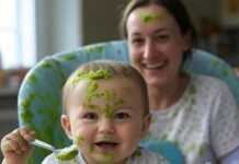 Introducing Solids: A Step-by-Step Guide for New Parents Baby with pea puree chaos, funny mess.