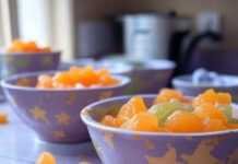 Top 10 Nutritious Baby Food Recipes to Try at Home Blurry kitchen counter with purees, sock, stars.