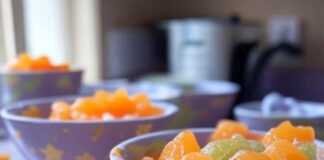Top 10 Nutritious Baby Food Recipes to Try at Home Blurry kitchen counter with purees, sock, stars.